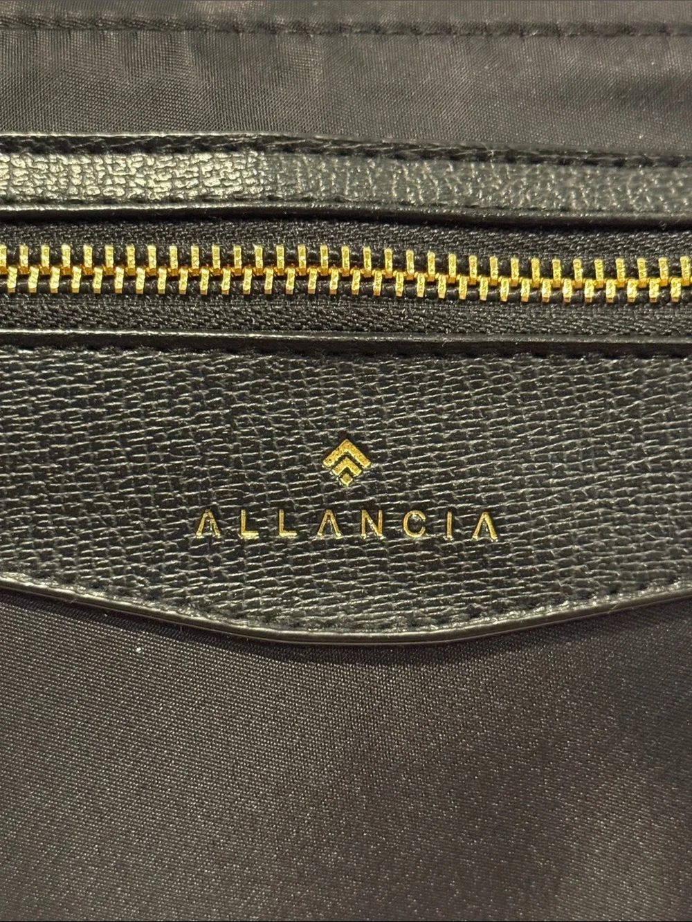 Allancia Peyton black nylon backpack featuring striking gold-tone hardware. NEW